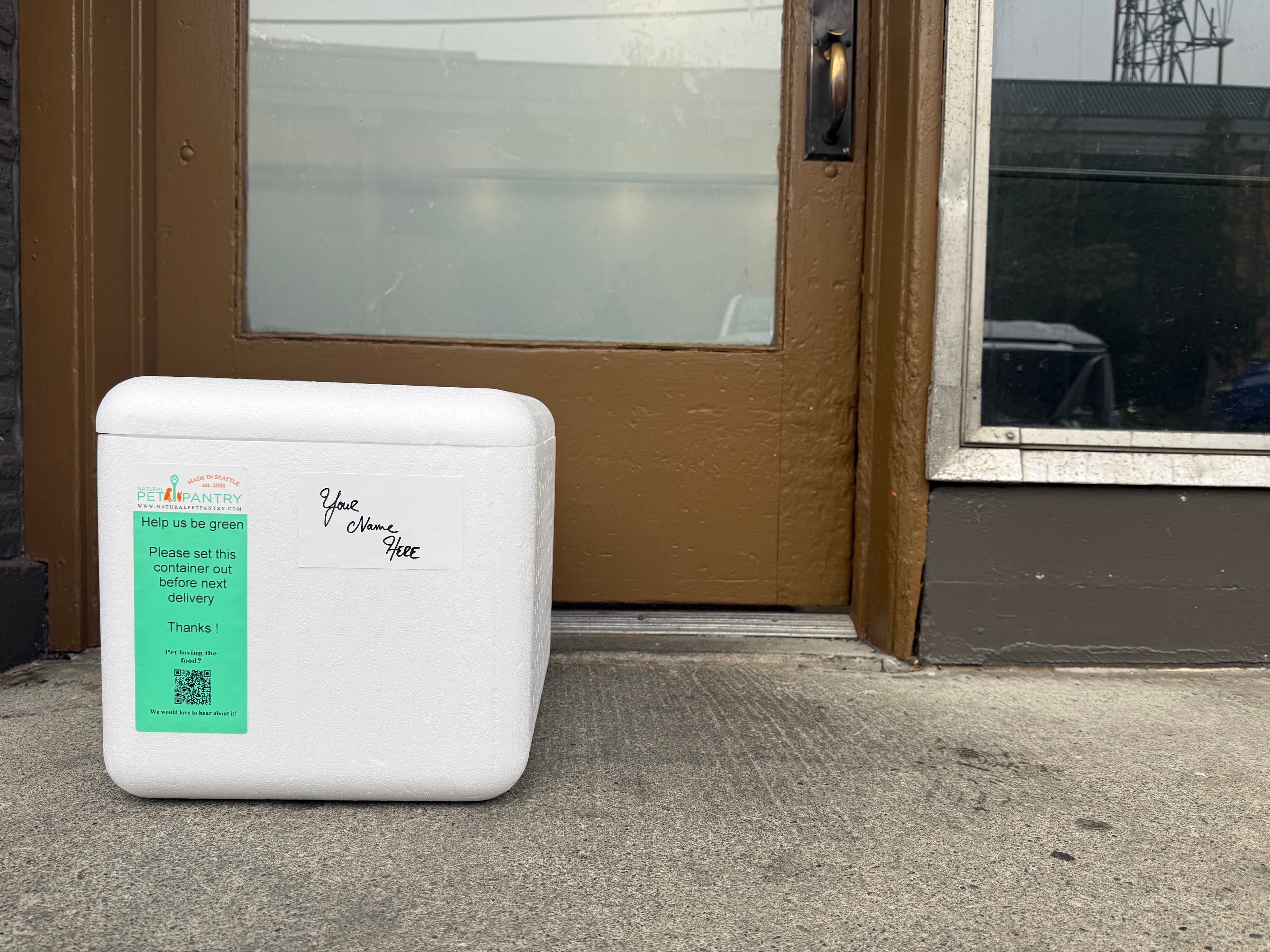 Natural Pet Pantry insulated delivery container at a customer's doorstep