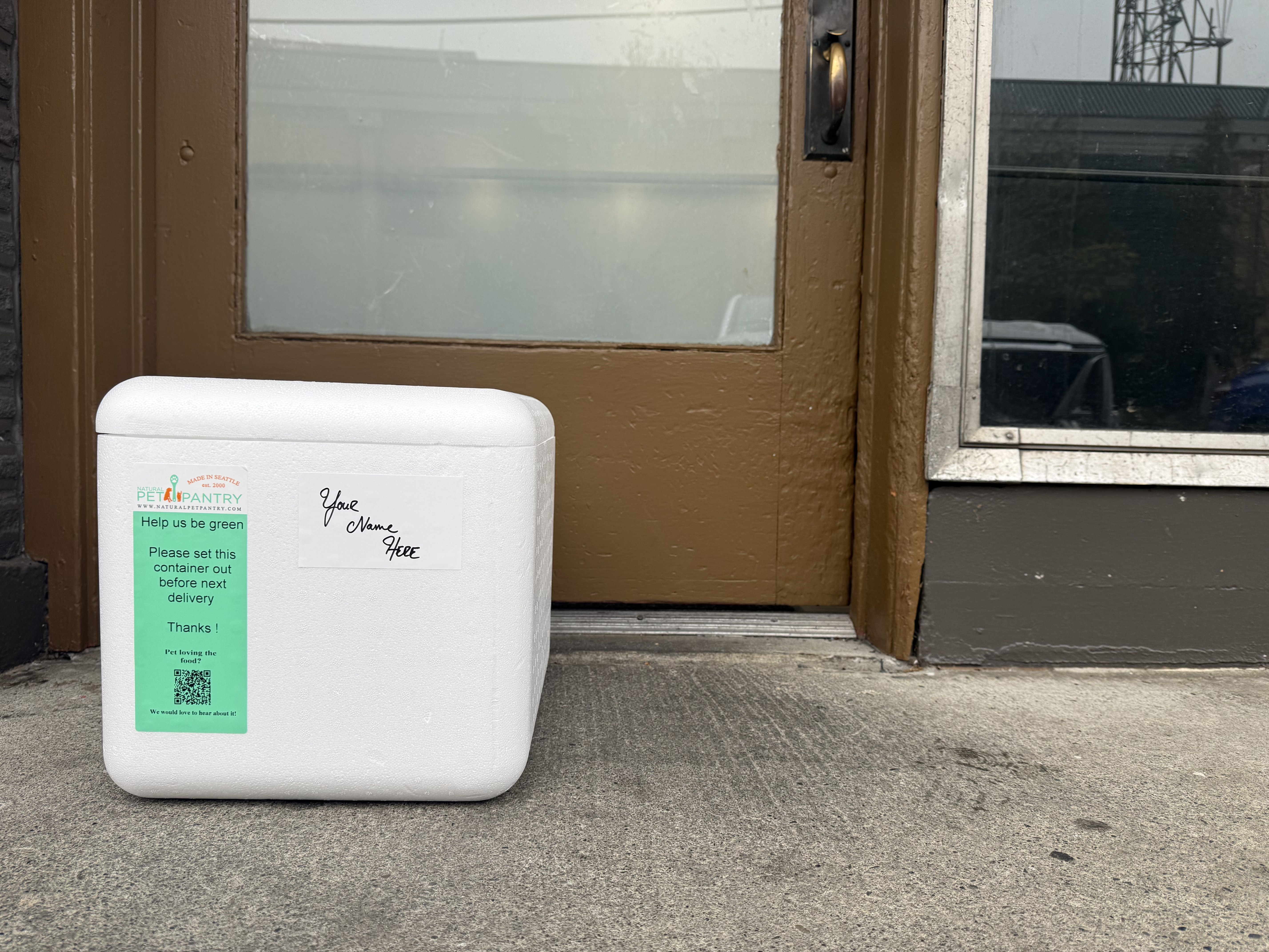 Natural Pet Pantry insulated delivery container at a customer's doorstep